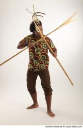 Man Adult Average Black Fighting with spear Standing poses Coat